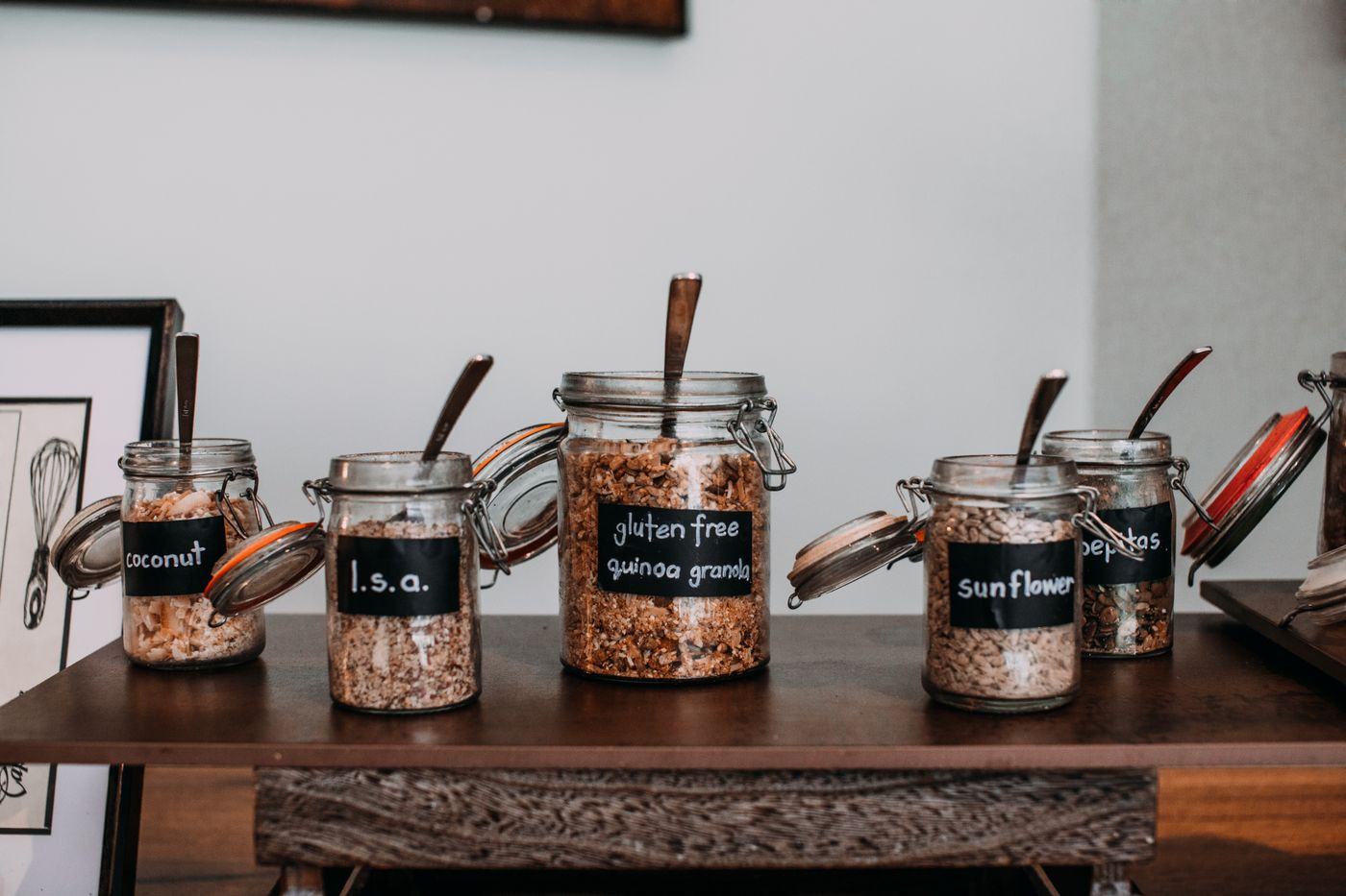 Labelled jars of dry ingredients on a café counter