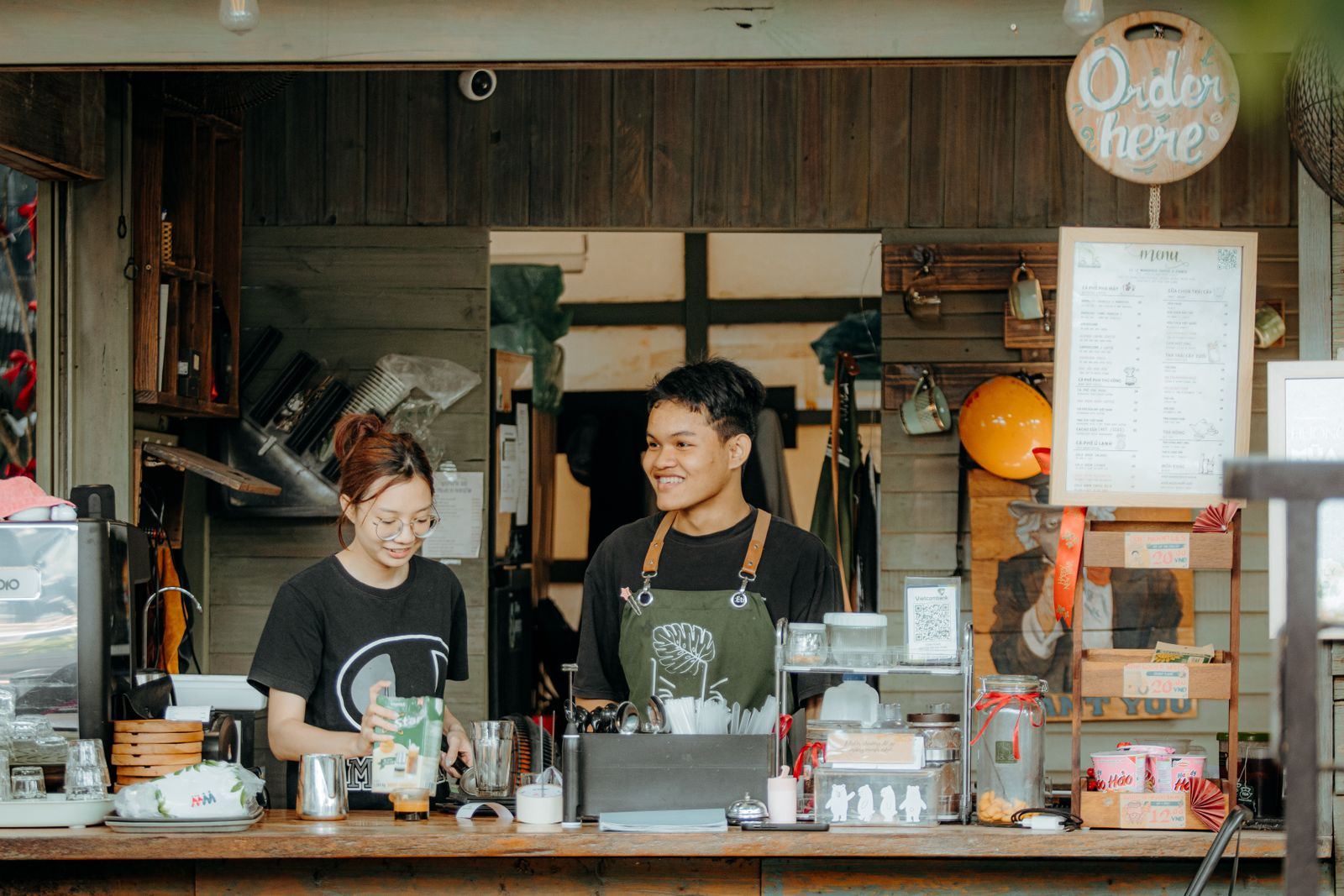 A café team in aprons