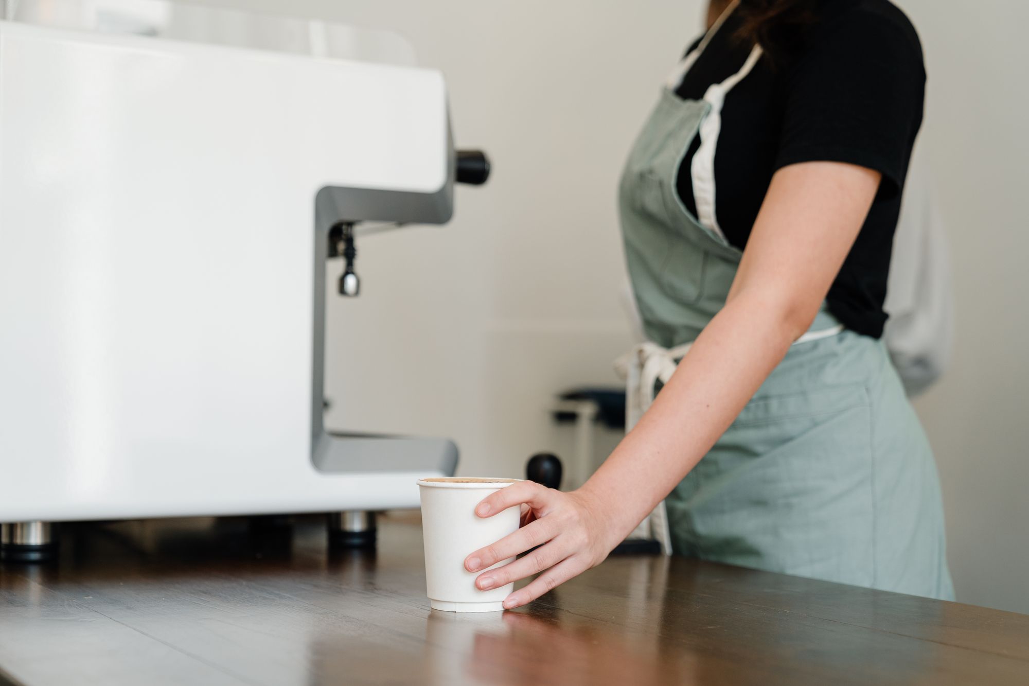 A barista serving a customer